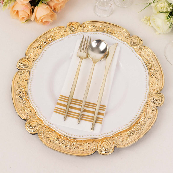 Elegant gold-accented dinner plate with gold utensils and napkin.