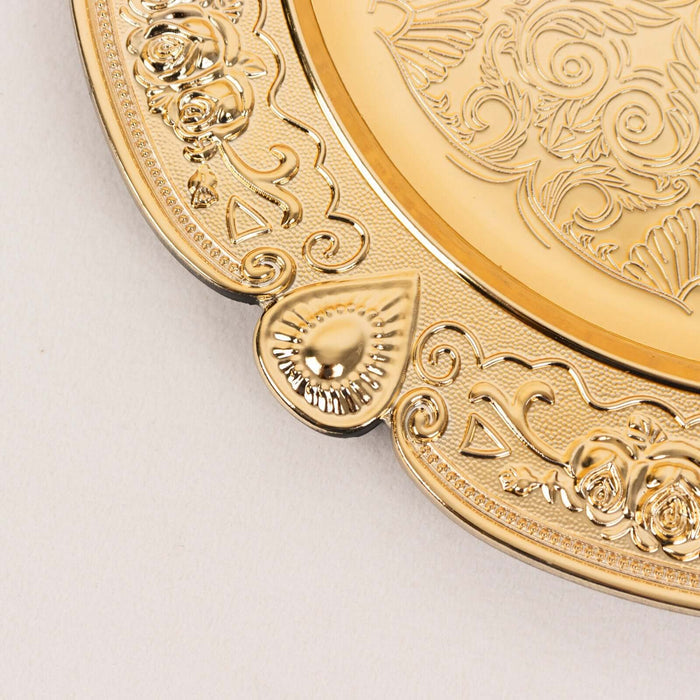 Gold decorative plate with intricate floral patterns and ornate detailing.