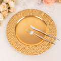 Gold decorative plate with knife and fork, surrounded by flowers.