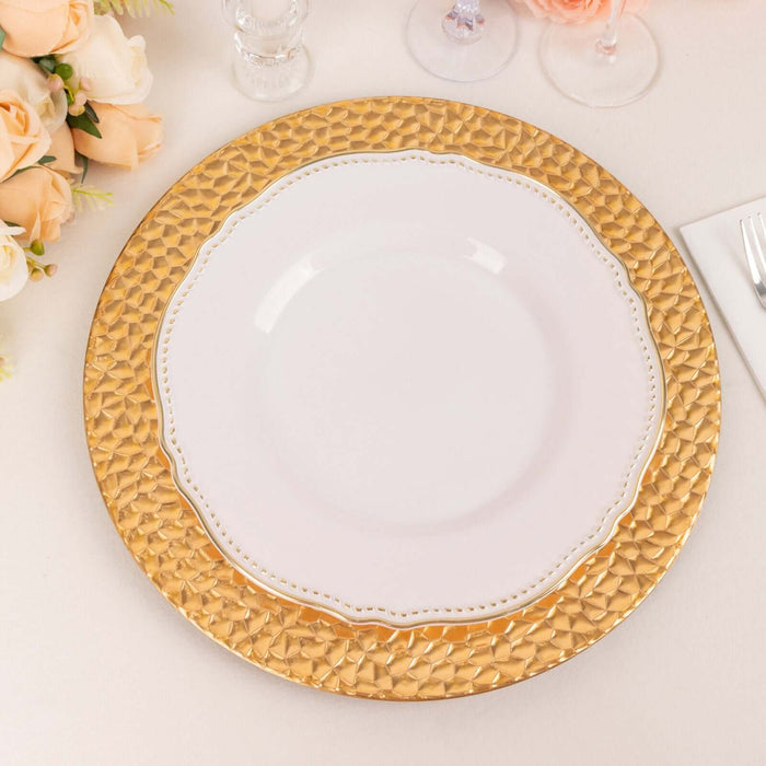 Elegant gold charger plate with white dinner plate on a stylish table setting.