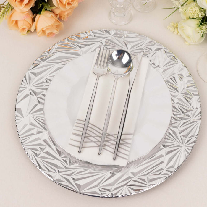Elegant silver charger plate with white dinner plate, silver cutlery, and napkin.