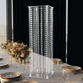 Elegant acrylic display stand with hanging crystals for event decor.
