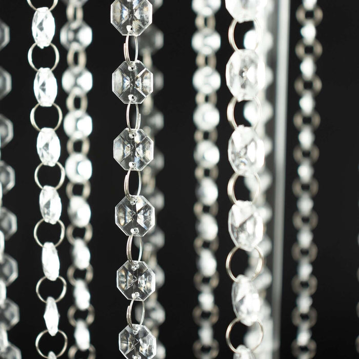 Crystal beaded curtain strands on a dark background.