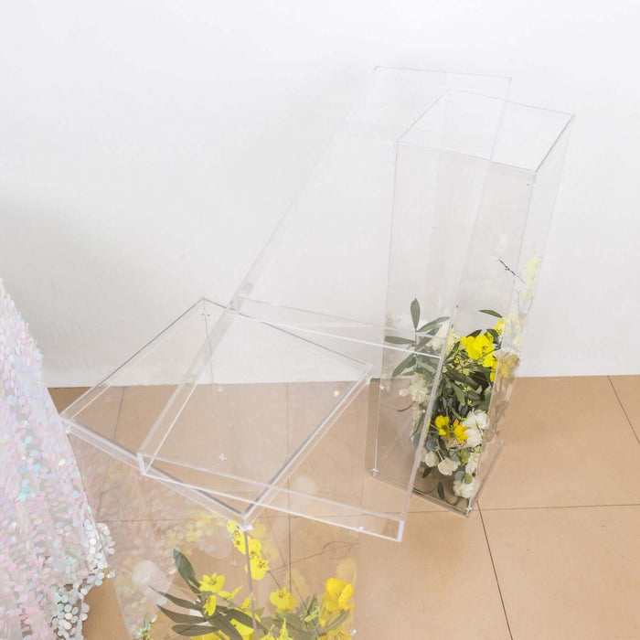 Acrylic display stand with yellow flowers, showcasing a modern design.