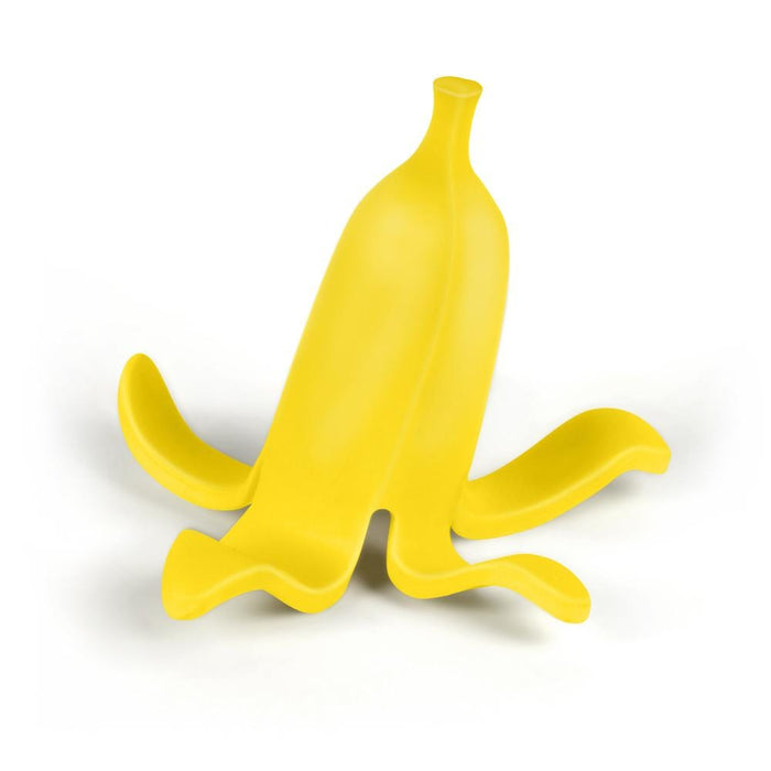 Yellow banana-shaped object on a white background. Yellow banana phone holder dunkin banana land alternative