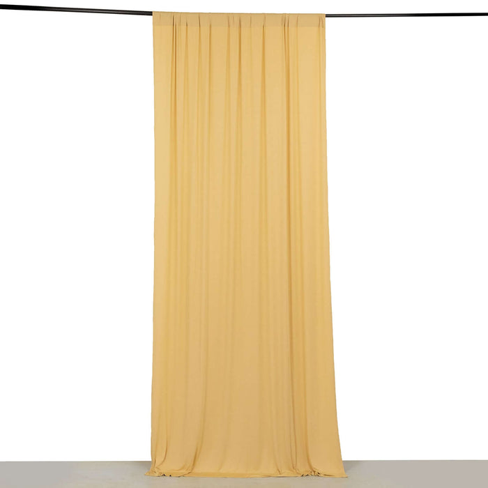 Yellow drapery fabric hanging in a studio setting