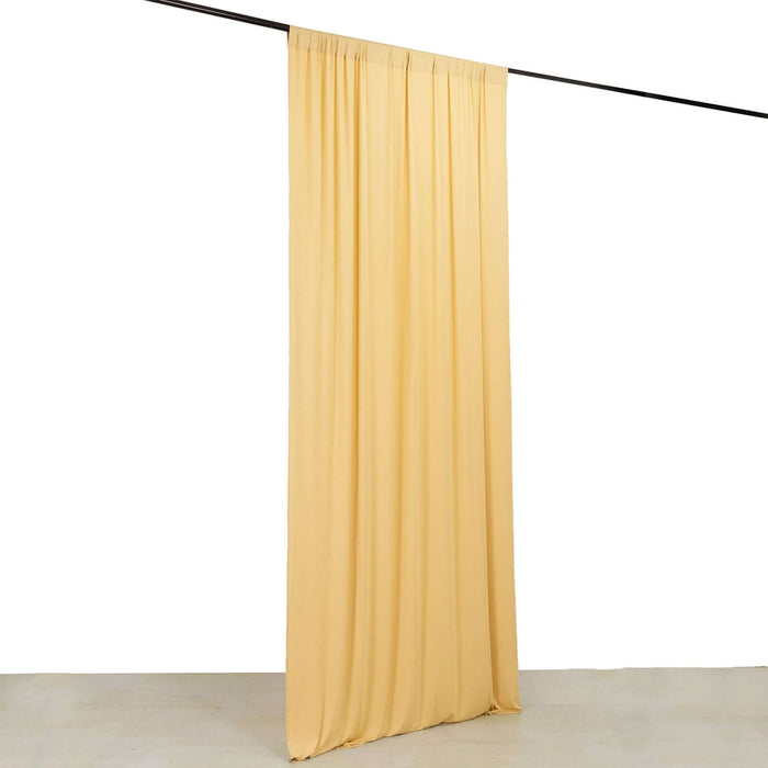 Yellow fabric curtain hanging from a rod against a white background