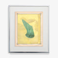 Abstract print with a teal fabric element against a light yellow background with faint shapes framed in silver