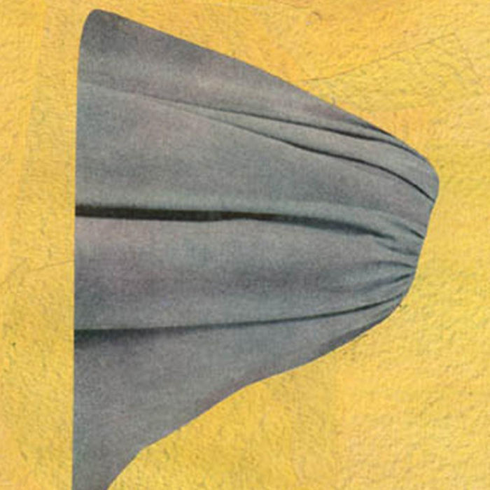 Close-up of an abstract print showing a grey folded fabric shape against a textured yellow background
