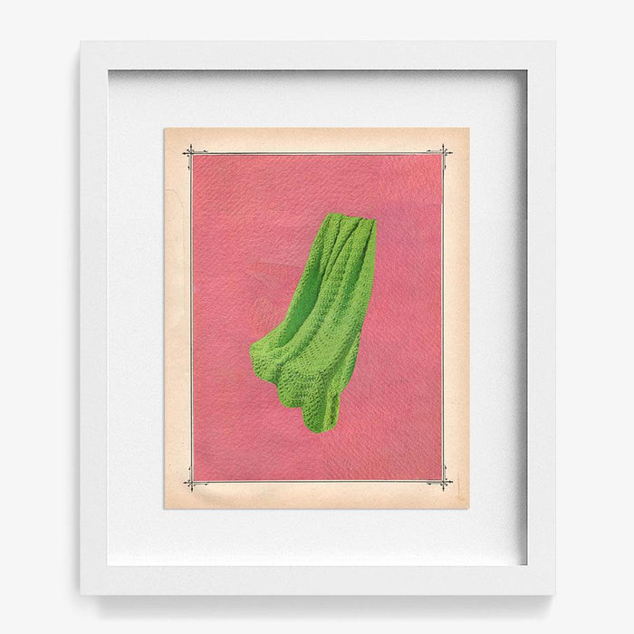 Framed print Color Play 132 with a white frame displaying green fabric on a pink background with a decorative border