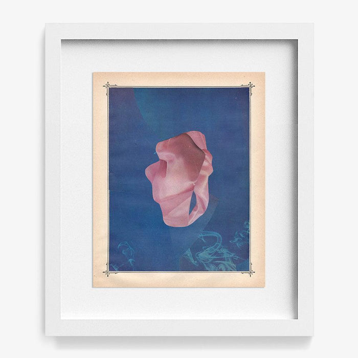 Abstract art print Color Play 141 in a white frame featuring a pink amorphous shape on a blue background