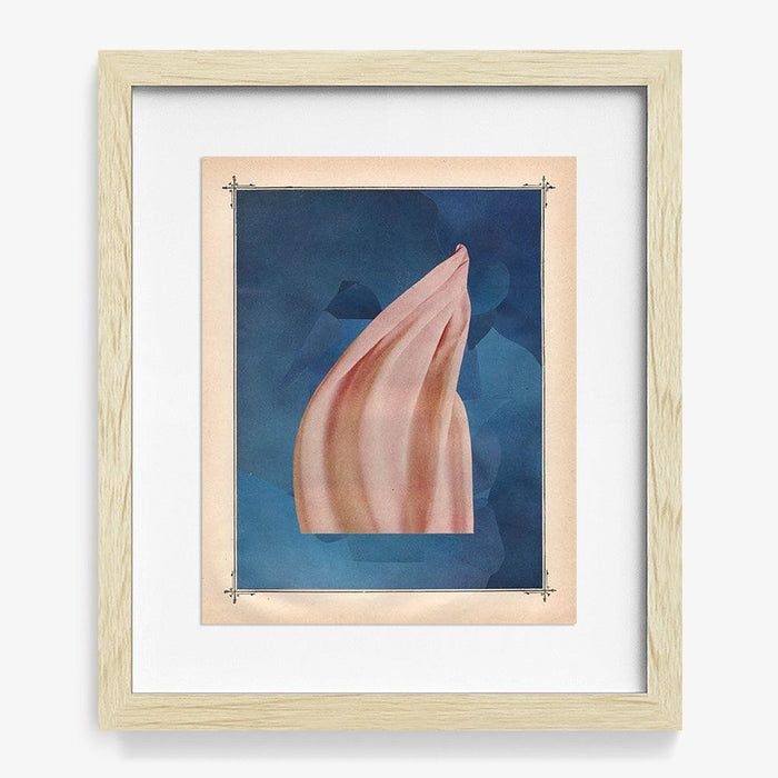 Abstract print in a light wood frame A pink flowing shape is centered against a dark blue background