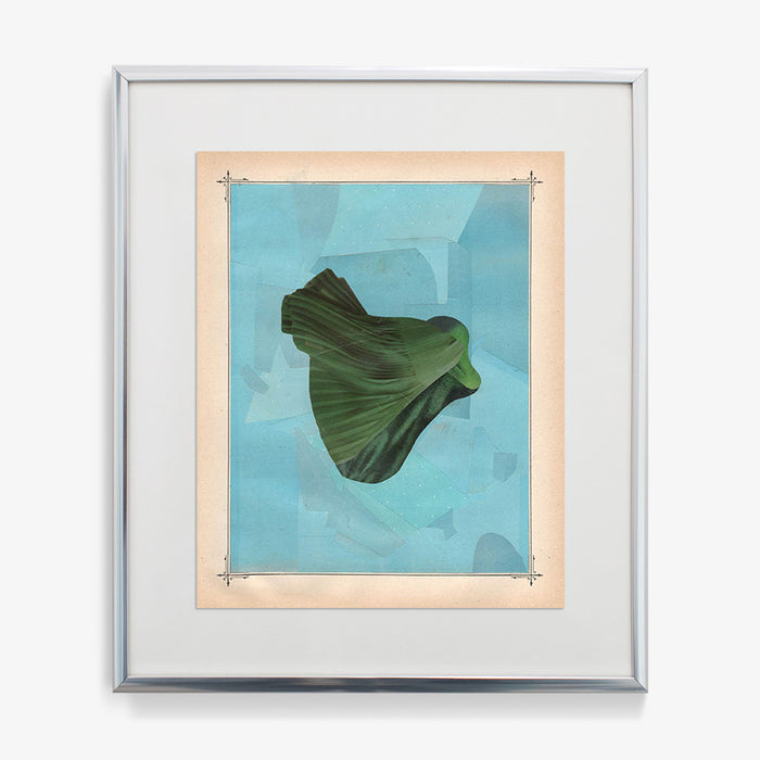 Abstract print with a dark green folded fabric-like shape against a light blue background in a silver frame