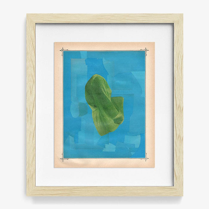 Framed abstract print A green folded fabric-like shape on a blue background in a light wood frame