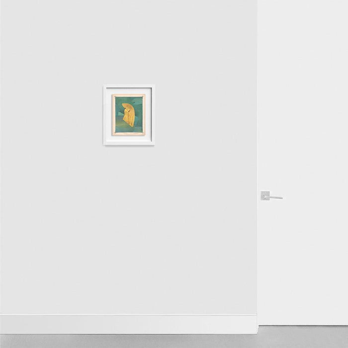 Framed print Color Play 94 featuring a yellow draped fabric shape on a blue-green background on a light gray wall