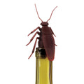 Red cockroach-shaped bottle stopper on a white background
