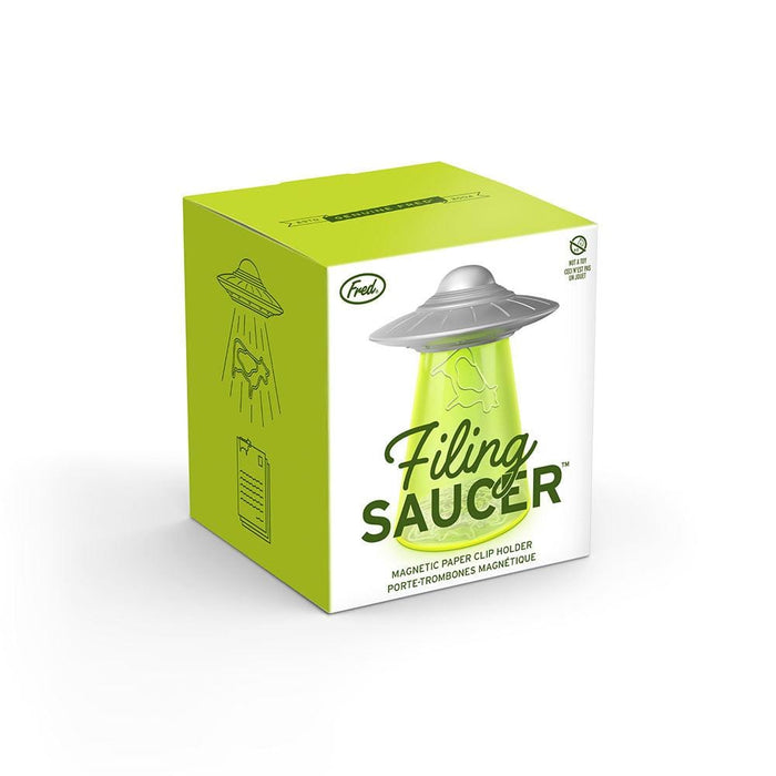 Side view of UFO-style paperclip holder with bright green base in gift-ready packaging — unique office desk gift under $15