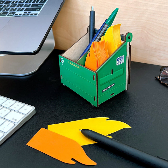 Side view of the Desk Dumpster pencil holder with flame note cards — novelty desk décor and stocking stuffer for coworkers.