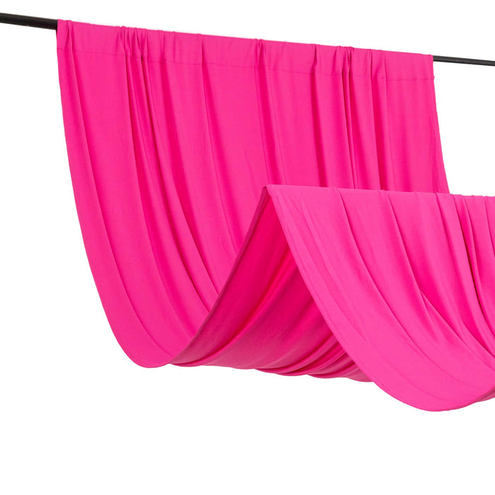 Bright pink fabric draped elegantly on a rod