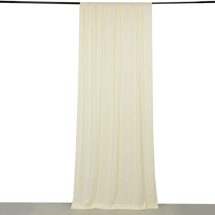 Cream sheer curtain hanging on a rod against a white background.
