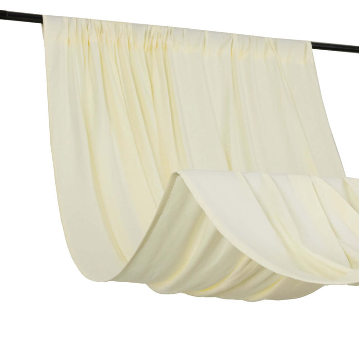 Cream curtain draped elegantly on a rod for a soft, airy look
