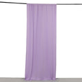 Purple fabric drape on a plain backdrop.