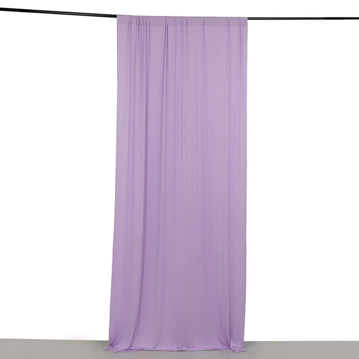 Purple fabric drape on a plain backdrop.
