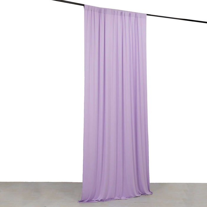 Purple fabric drape hanging from a rod against a white backdrop