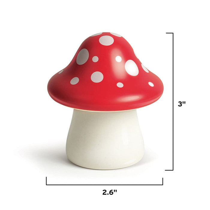 A ceramic mushroom. Image shows product dimensions 2.6 x 3"