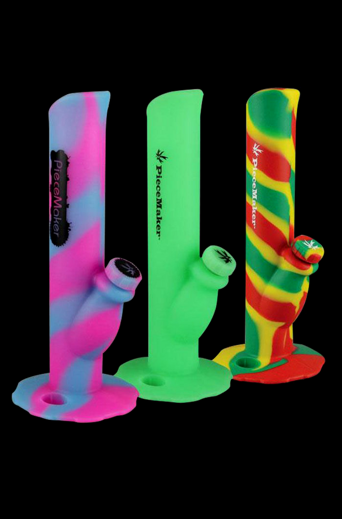 Colorful silicone water pipes (bongs) with cannabis leaf accents, branded “PieceMaker”.