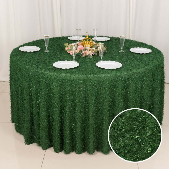 Green grass tablecloth draping a round table set for a gathering.