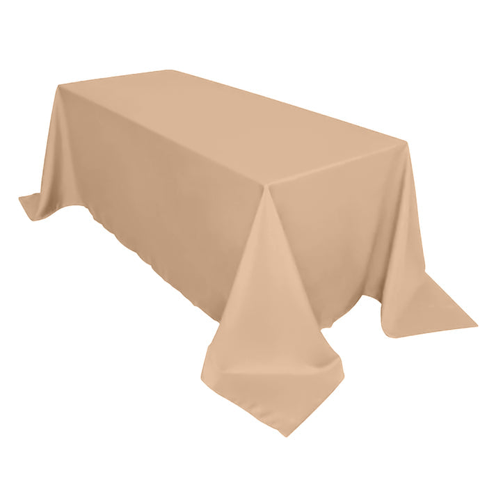Beige tablecloth on a table against a plain background