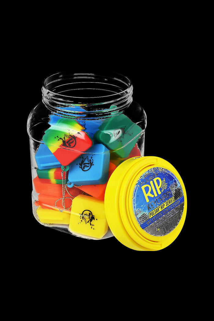 An overhead shot shows the bulk 30 pack of Pulsar Silicone Dab Slab Containers, each in a different translucent color.