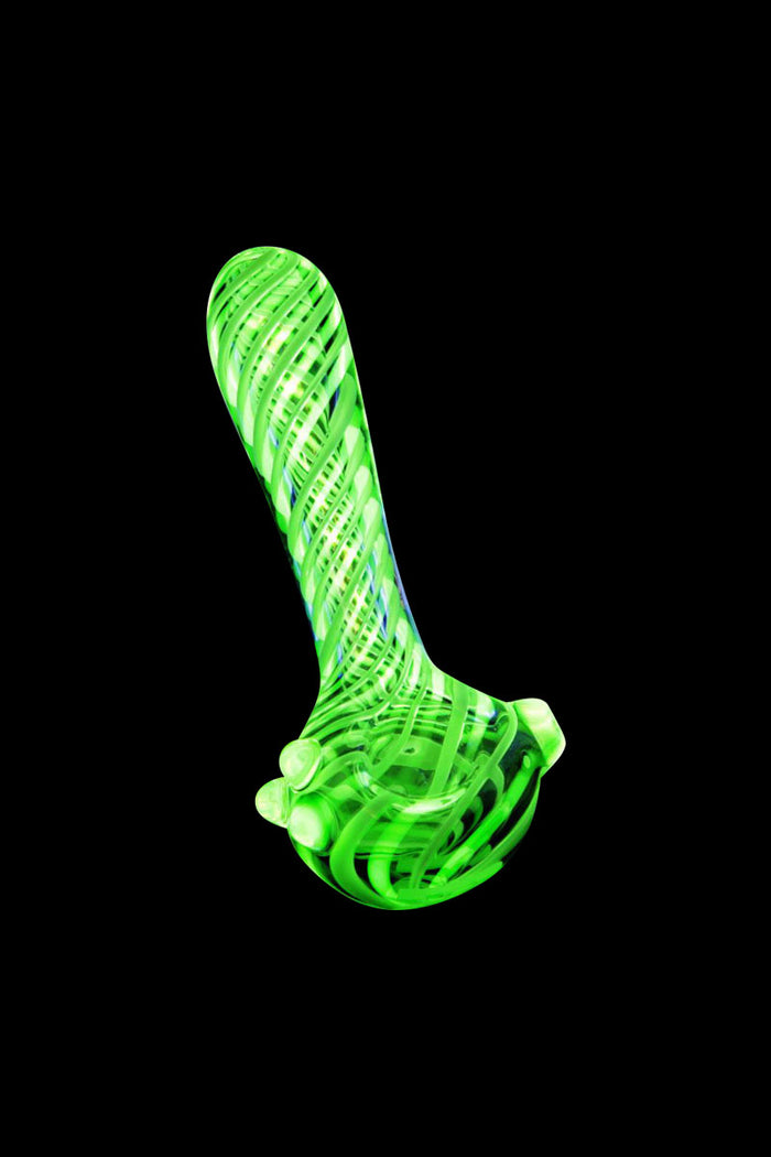 A three-quarter view of the Pulsar UV Candy Stripe Spoon Pipe, showcasing its colorful striped design against a dark background.