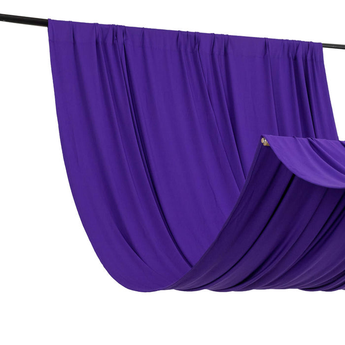 Purple fabric draped on a rod, showcasing its smooth texture and rich color.