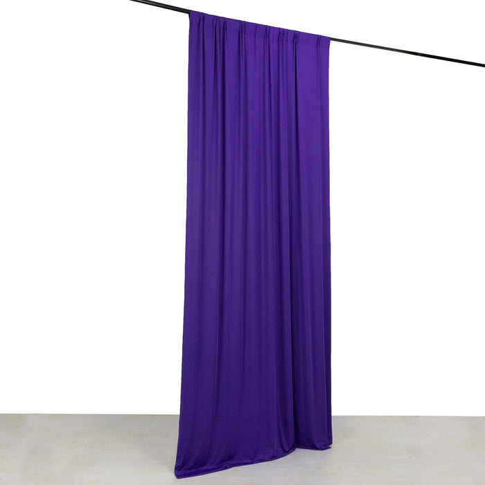 Purple fabric drape hanging from a rod against a white background