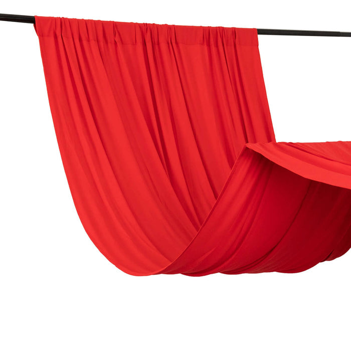 Red draped fabric on a black rod for photography or staging purposes