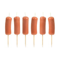 A set of 6 party candles that look like cocktail wieners