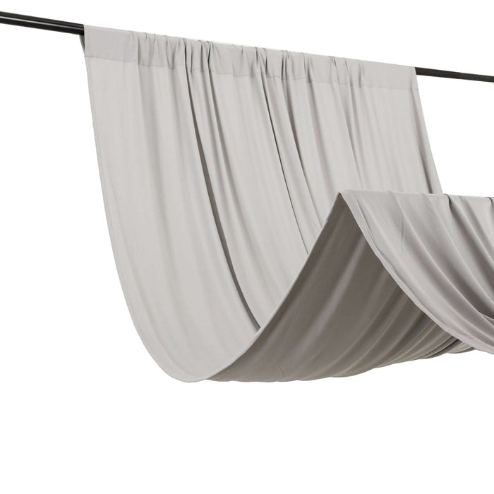 Gray drapery fabric hanging on a rod