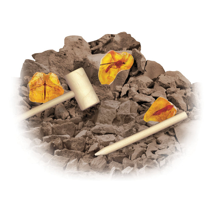 The Smithsonian Amber Dig Value Set by Smithsonian is an educational kit featuring imitation amber with bug shapes, brown rocks, and includes a wooden mallet and chisel for excavation fun.
