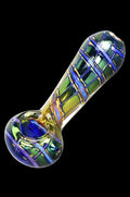 A diagonally angled view of the Butterfly Wing Macro Fumed Spoon Pipe, showcasing its colorful, swirling glass design.
