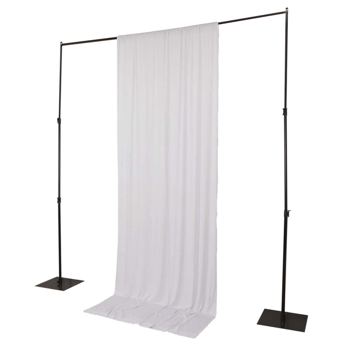 White backdrop stand with fabric drape for photography setups